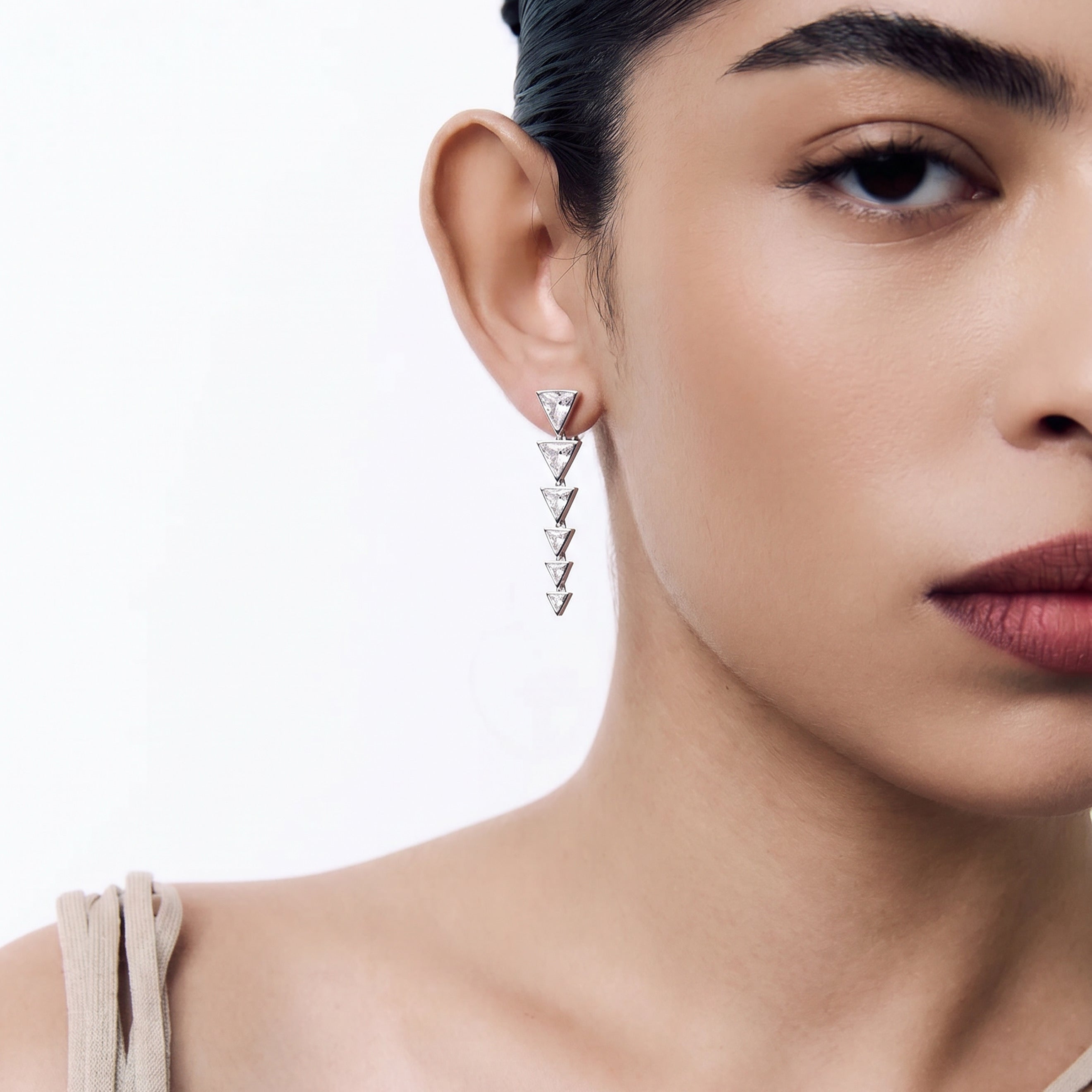 Les boucles d’oreilles Triangoli